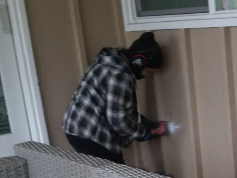 Professional electrician installing an exterior outlet in Newcastle